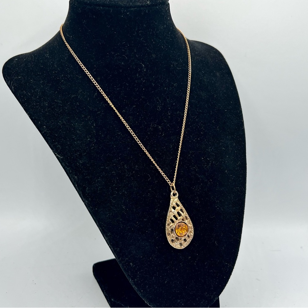 Vintage gold basket weave pendant with orange rhinestone on 16” chain